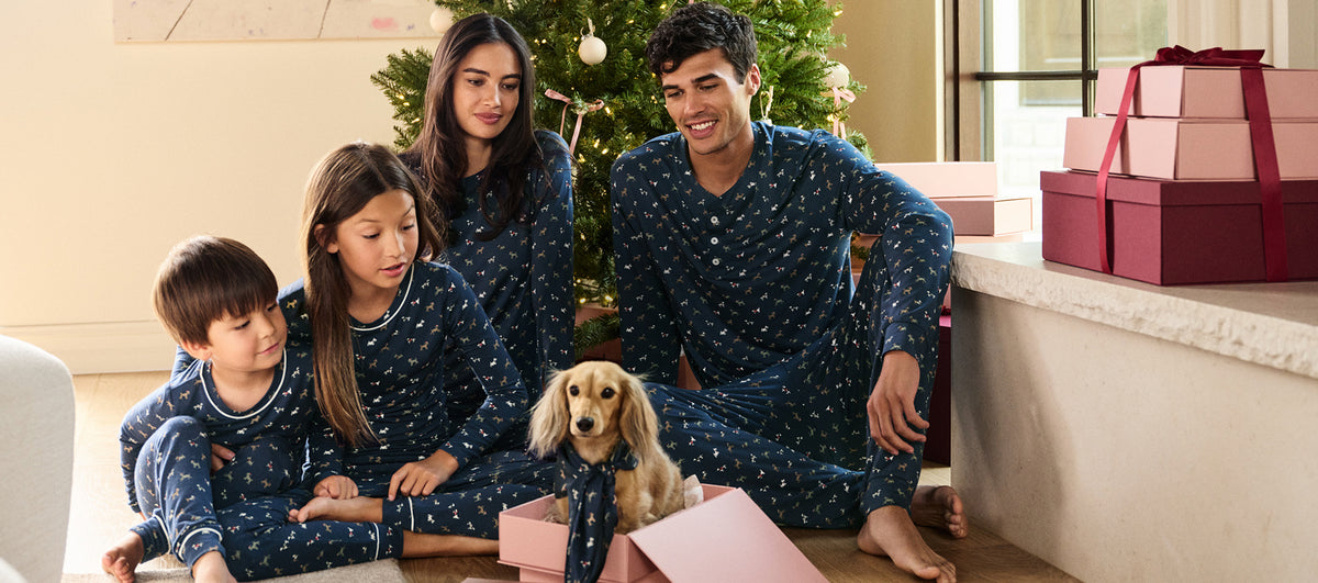 Models are wearing printed TENCEL™ Modal in Santa Paws Navy/Ivory