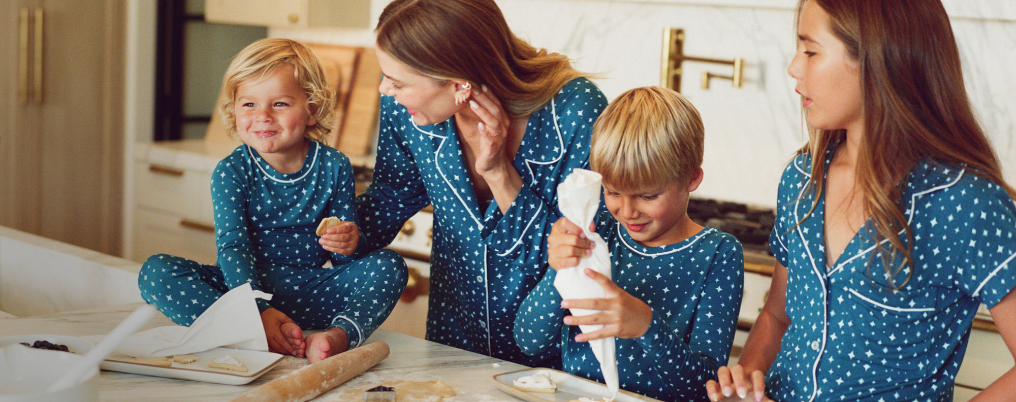 Model of family in Festive Lights Printed PJs