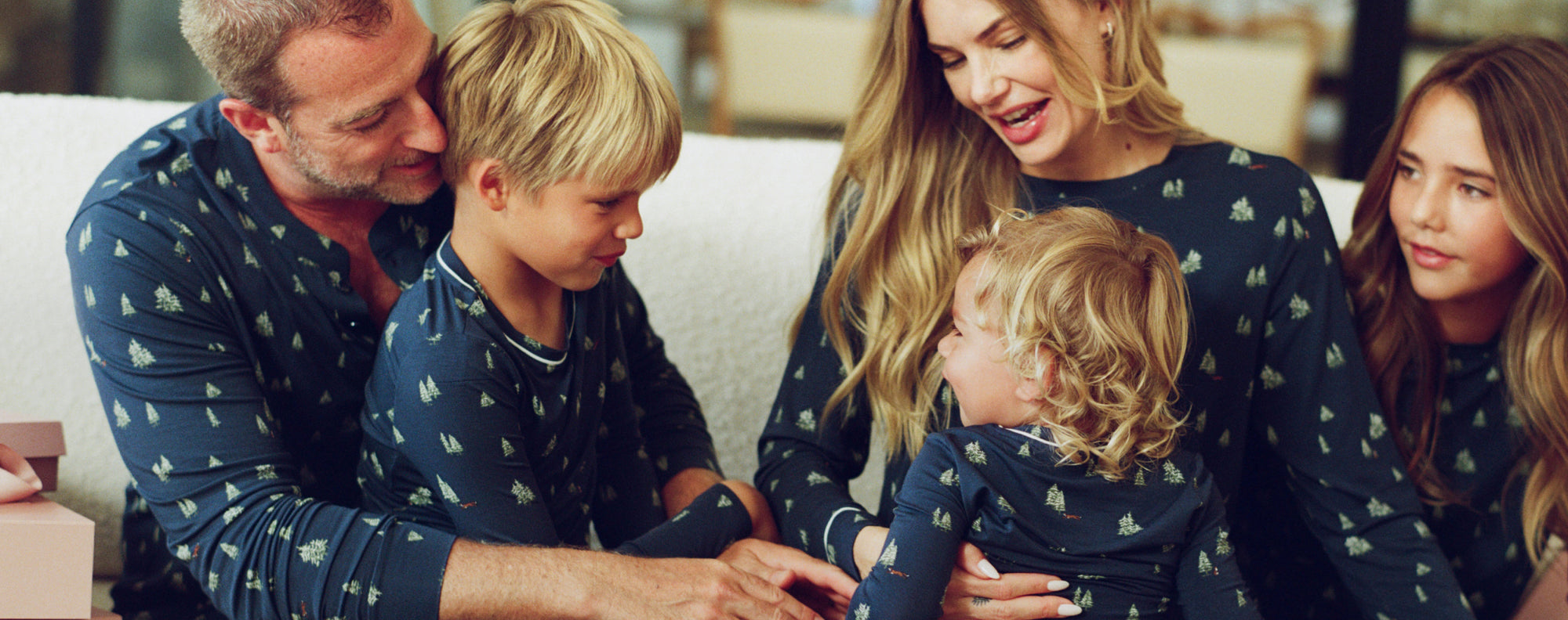 Family of models in Henry Long PJ, Gisele Crewneck Long PJ and Kid's Unisex Long PJs in Woodland Pine Navy