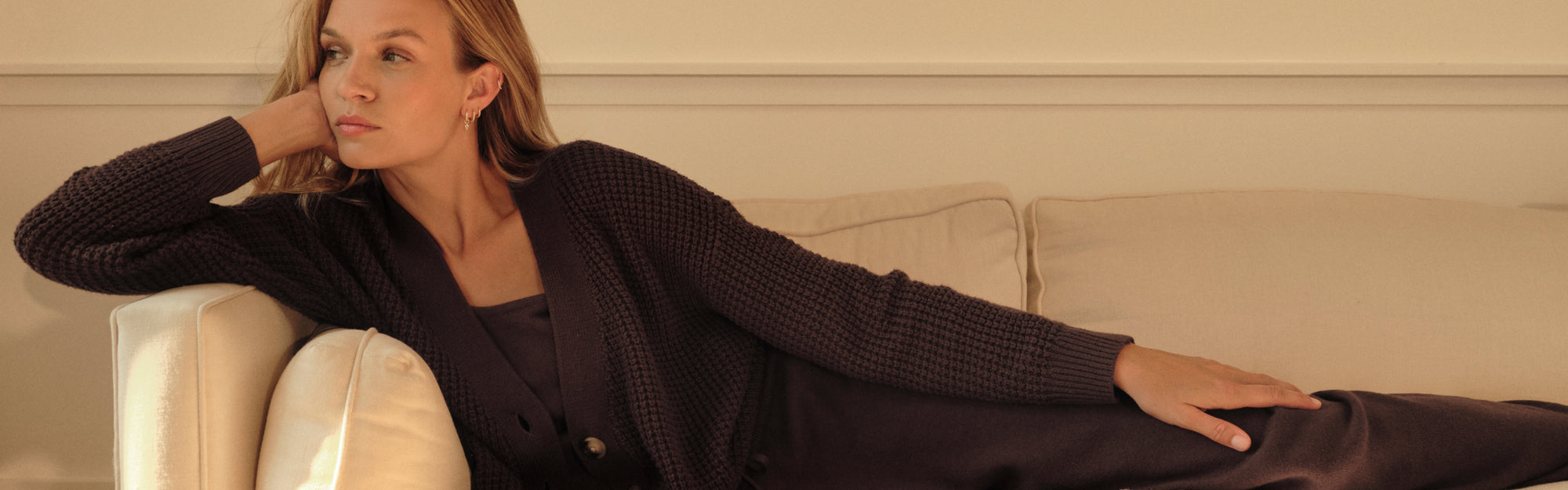 Model is wearing Recycled Sweater Cardigan and Pants in Chocolate