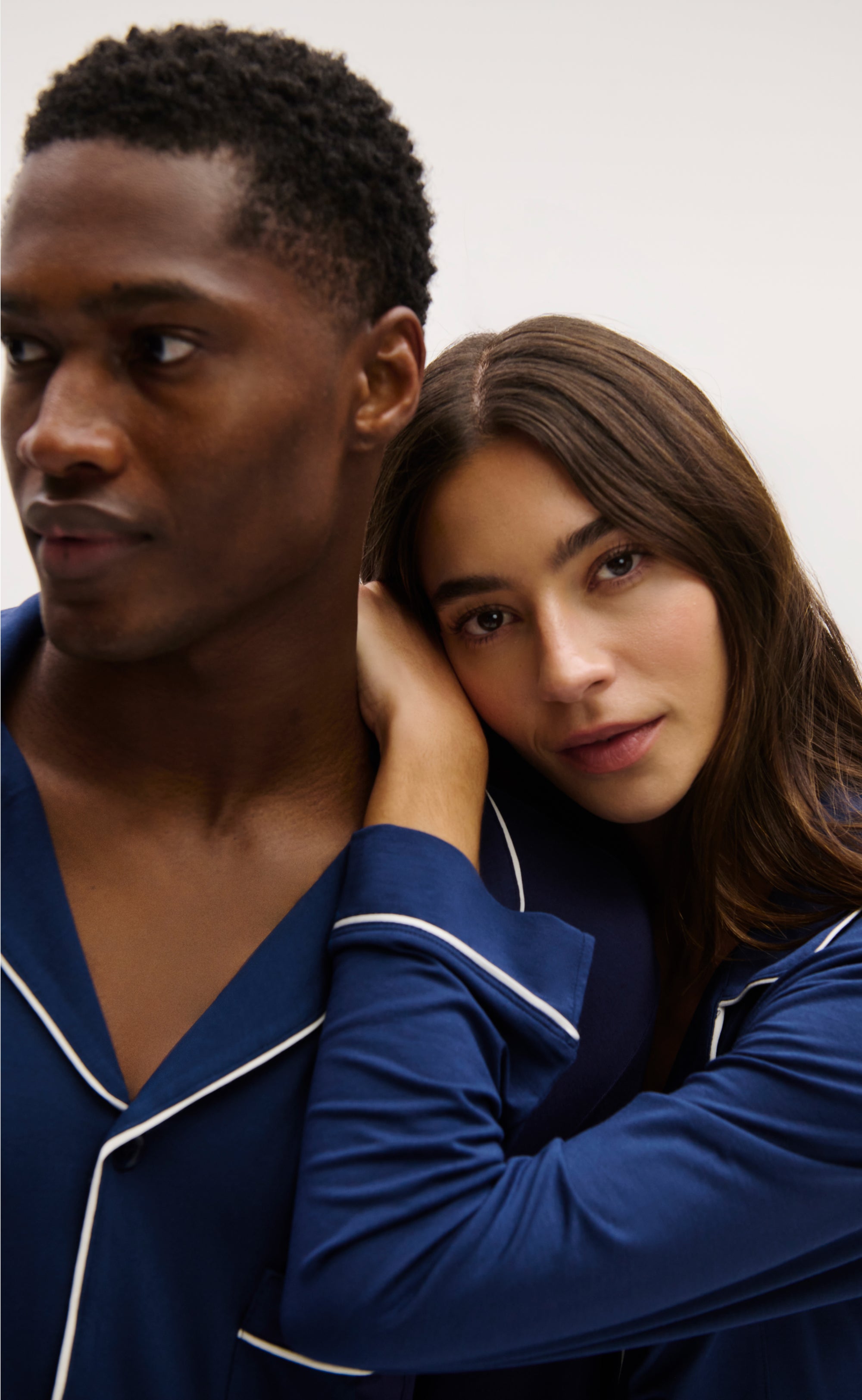 Models wearing Gisele PJs and Henry PJs in Navy/Ivory