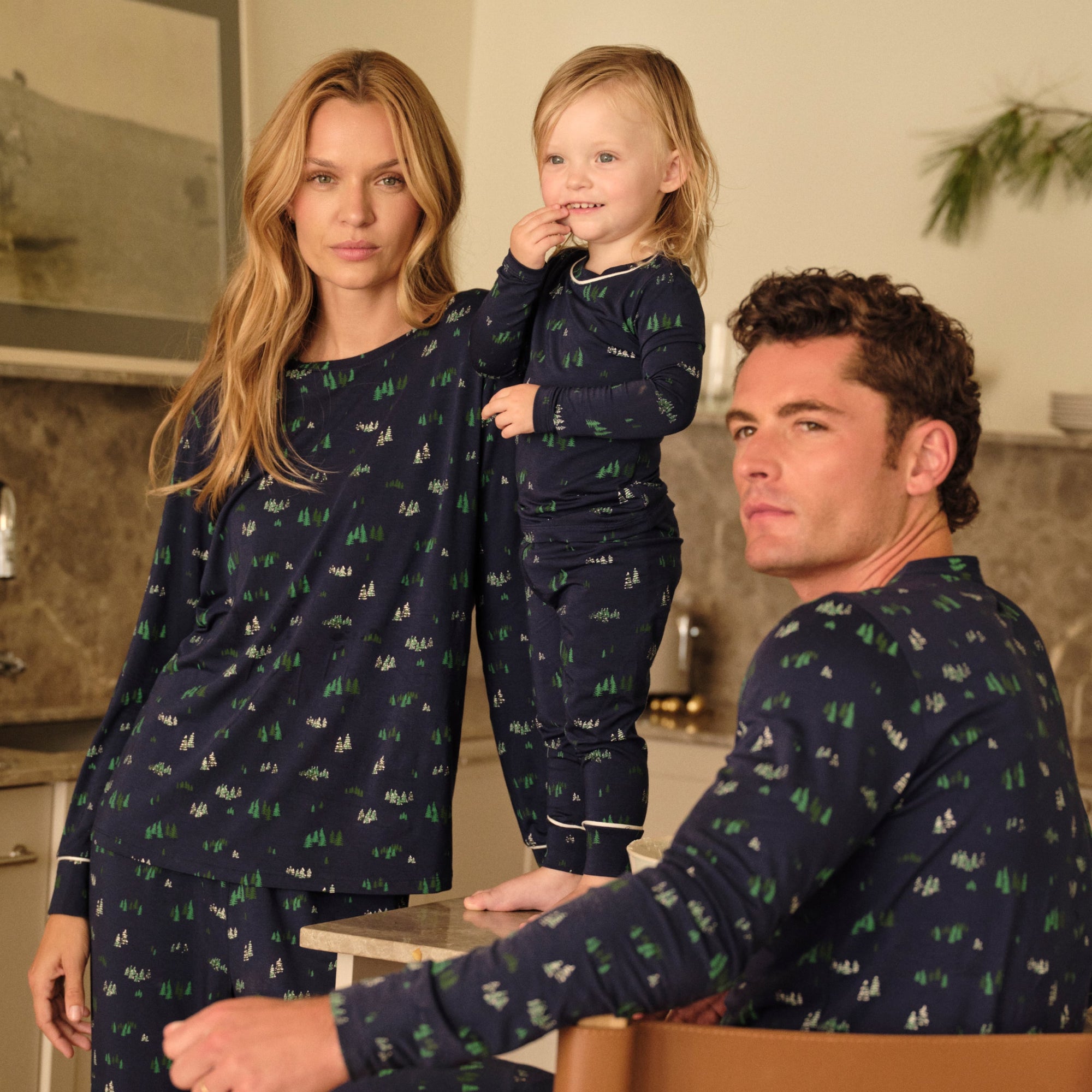 Family wearing matching Forest Pine Navy PJs