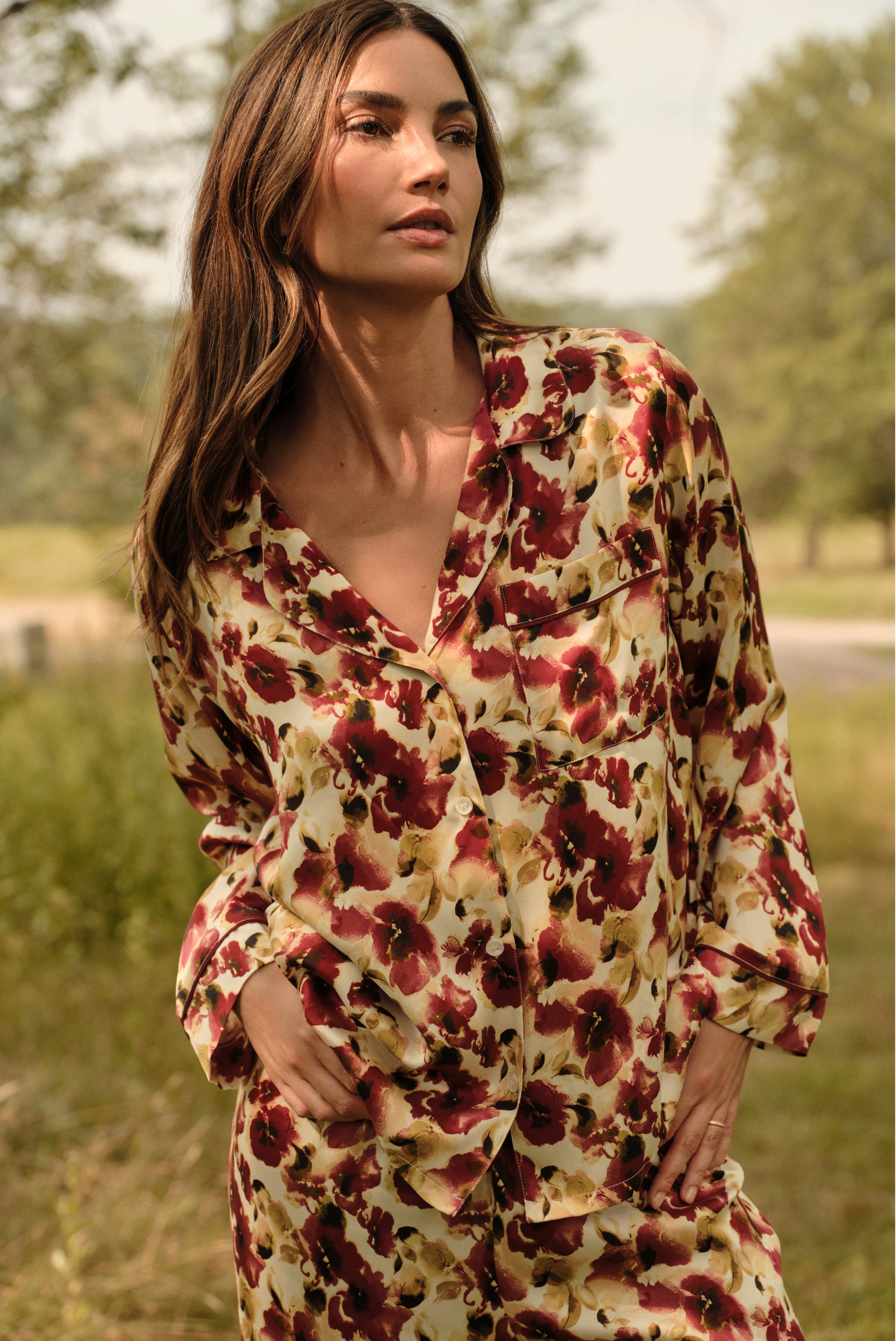Model is wearing Inez Washable Silk Long PJ Set in Botanical Flower Merlot 