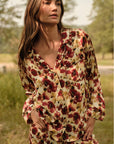 Model is wearing Inez Washable Silk Long PJ Set in Botanical Flower Merlot 