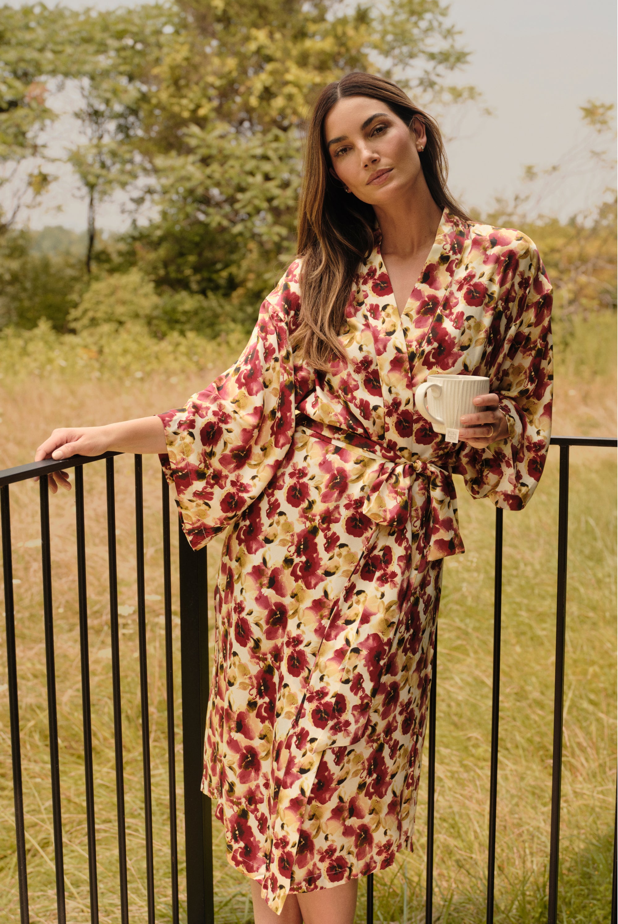 Model is wearing Inez Washable Silk Long Robe in Botanical Flower Merlot 