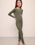 Model wears Kids TENCEL™ Modal Unisex Long PJ Set in moss/ivory.