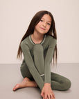 Model wears Kids TENCEL™ Modal Unisex Long PJ Set in moss/ivory.