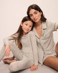 Model wears Kids Printed TENCEL™ Modal Unisex Long PJ Set in Ella Spark/Moss.