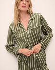 Model is wearing Inez Washable Silk Printed Long PJ Set in Classic Stripe Moss/Moss.