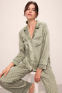 Model is wearing Inez Washable Silk Printed Long PJ Set in Geo Sphere Moss/Navy.