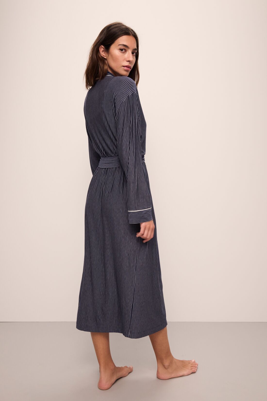 Model wears Gisele Printed TENCEL™ Modal Long Robe in Duo Stripe True Navy/Ivory.