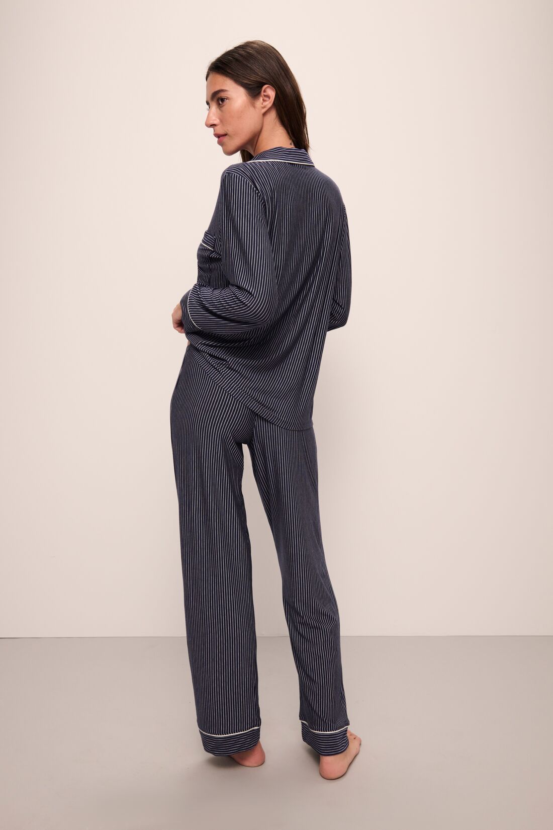 Model wears Gisele Printed TENCEL™ Modal Long PJ Set in Duo Stripe True Navy/Ivory.