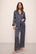 Model wears Inez Washable Silk Printed Long PJ Set in Classic Stripe Navy/Ivory.