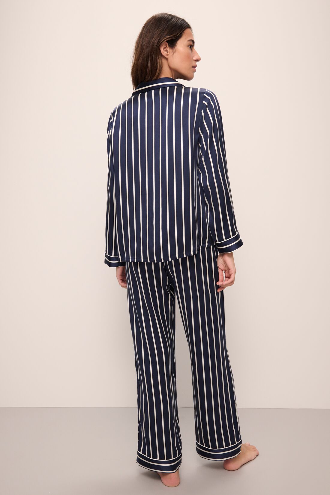 Model wears Inez Washable Silk Printed Long PJ Set in Classic Stripe Navy/Ivory.