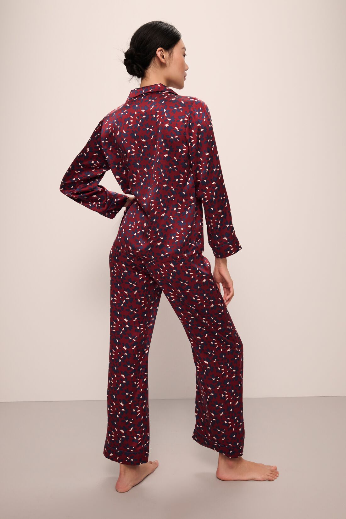 Model wears Inez Washable Silk Printed Long PJ Set in Winter Bloom Cabernet/Navy.