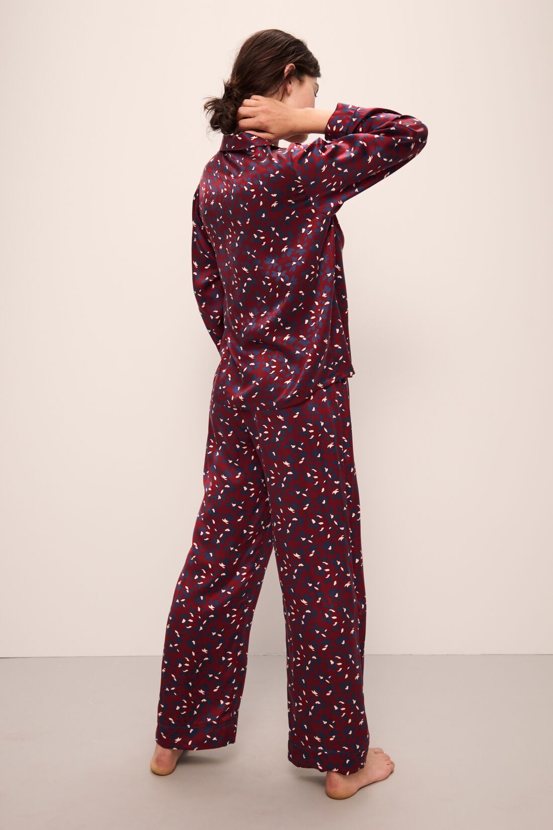 Model wears Inez Washable Silk Printed Long PJ Set in Winter Bloom Cabernet/Navy.