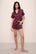 Model wears Inez Washable Silk Printed Short PJ Set in Winter Bloom Cabernet/Navy.