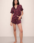 Model wears Inez Washable Silk Printed Short PJ Set in Winter Bloom Cabernet/Navy.