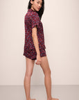 Model wears Inez Washable Silk Printed Short PJ Set in Winter Bloom Cabernet/Navy.