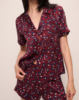 Model wears Inez Washable Silk Printed Short PJ Set in Winter Bloom Cabernet/Navy.