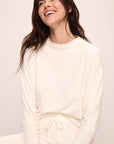 Model wears Cozy Time Mock Neck Pullover in Ivory.