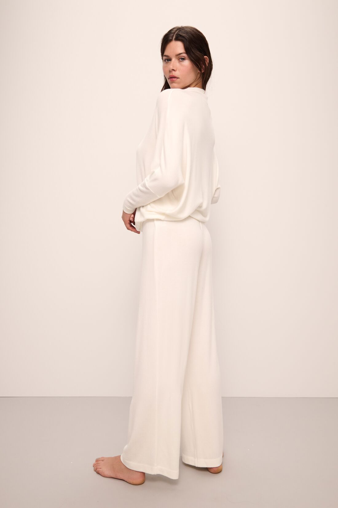 Model wears Cozy Time Wide Leg Pant in Ivory.