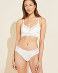 Model wears Rosalia TENCEL™ Modal Bralette in ivory.