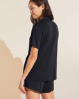 Model wears Gisele TENCEL™ Modal Rib Relaxed Short PJ Set in Black.