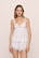 Model is wearing the Beatrix TENCEL™ Modal Cami & Short PJ Set in White