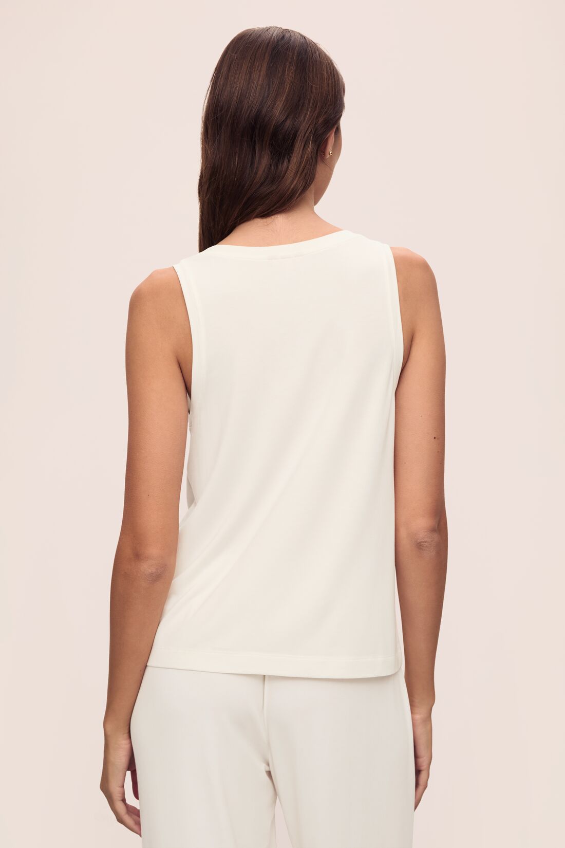 Model is wearing Gisele TENCEL™ Modal Everyday Tank in ivory.