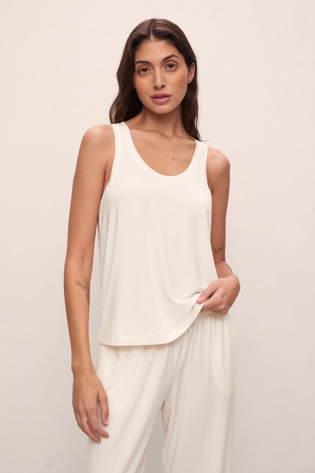 Model is wearing Gisele TENCEL™ Modal Everyday Tank in ivory.