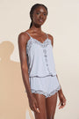 Model wears Mariana TENCEL™ Modal Romper in Ice Blue.