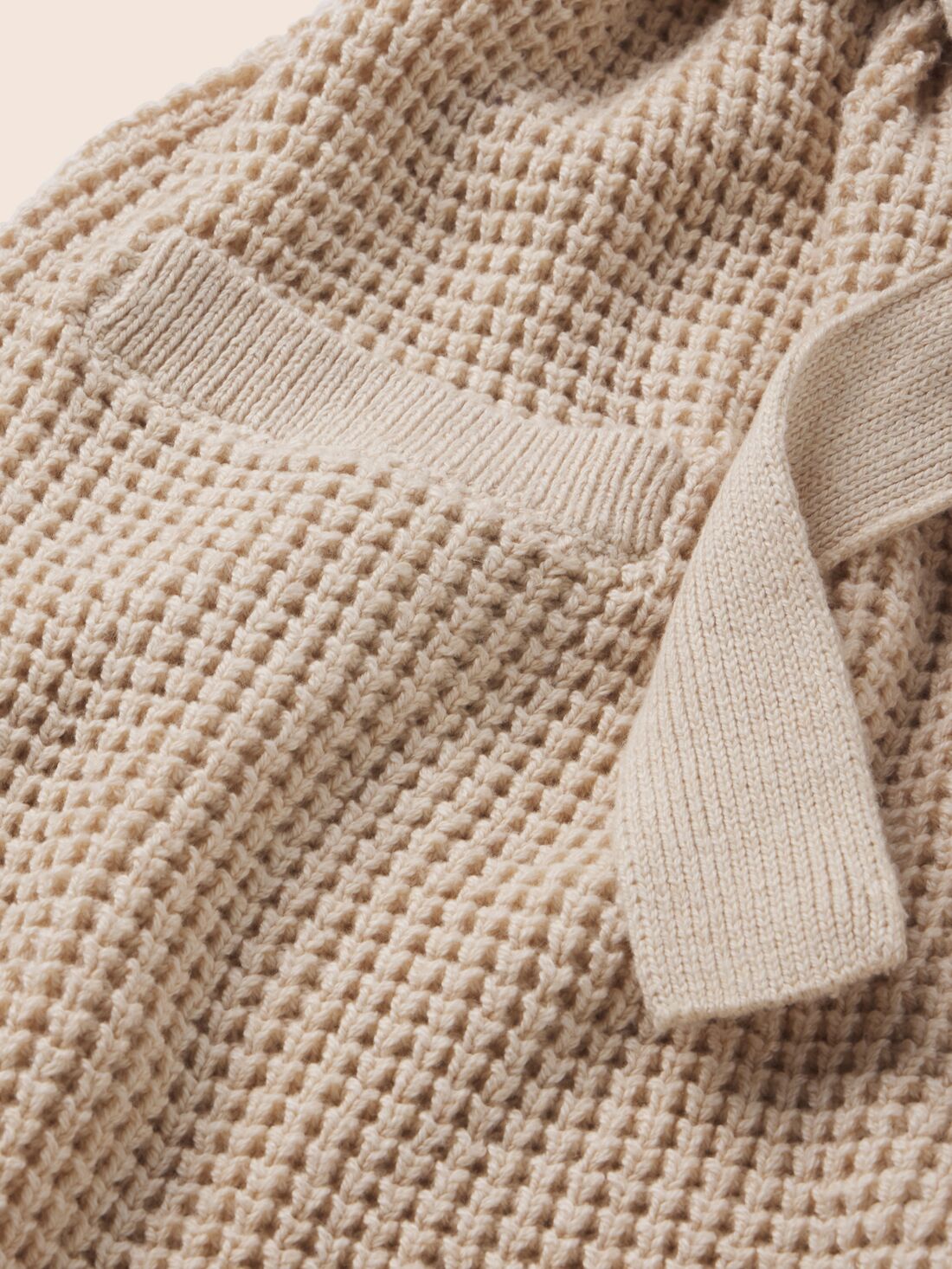 Image of Recycled Sweater Short Wrap in Oat fabric detail.