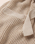 Image of Recycled Sweater Short Wrap in Oat fabric detail.