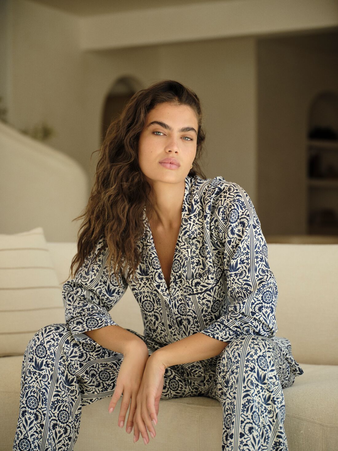 Model is wearing Eberjey x Casa Del Sol Inez Washable Silk Long PJ Set in Azulejos Navy/Navy