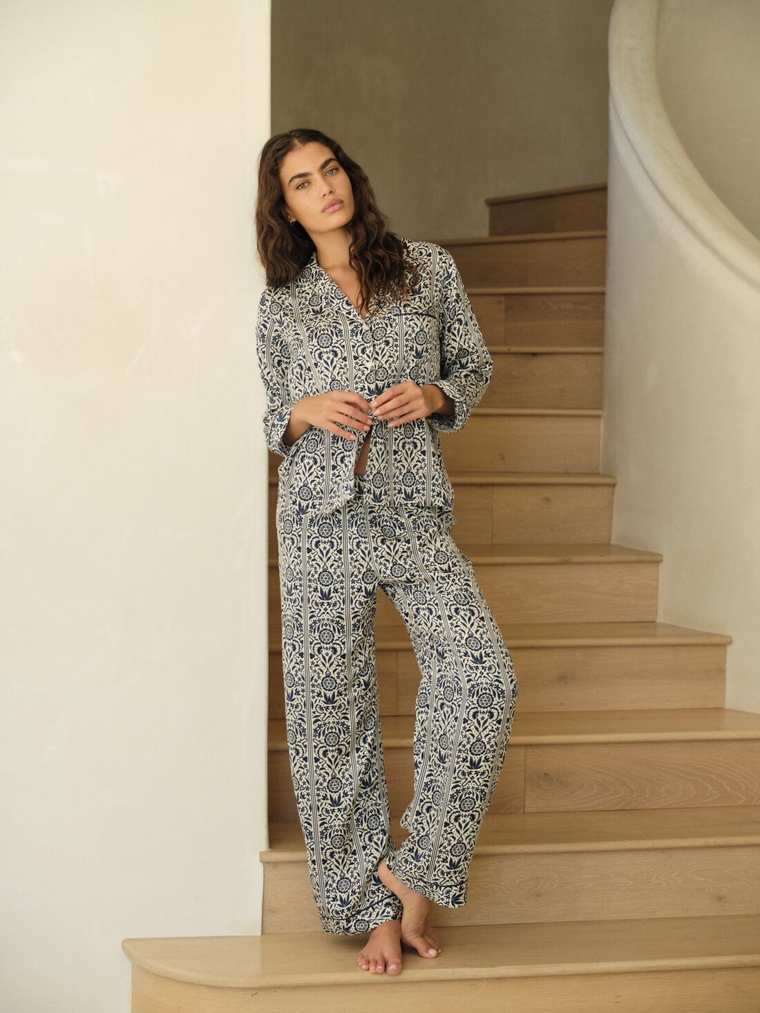 Model is wearing Eberjey x Casa Del Sol Inez Washable Silk Long PJ Set in Azulejos Navy/Navy