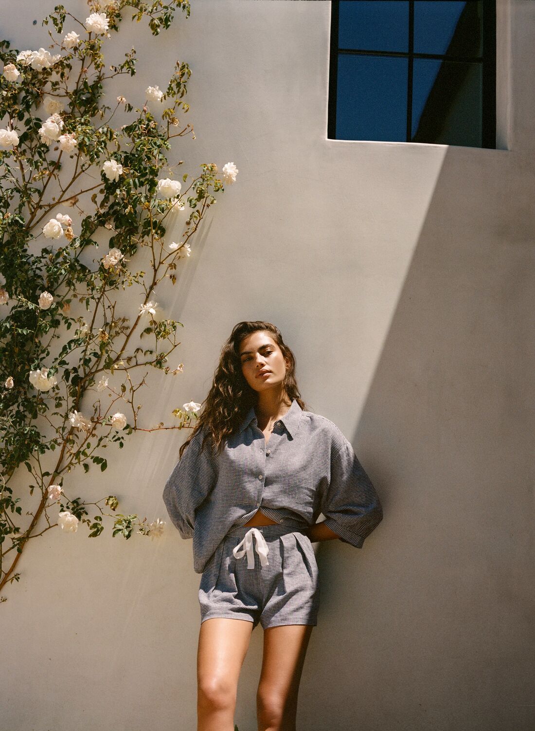 Model is wearing Linen Blend Relaxed Quarter Sleeve Top and Short in Gingham White/Navy