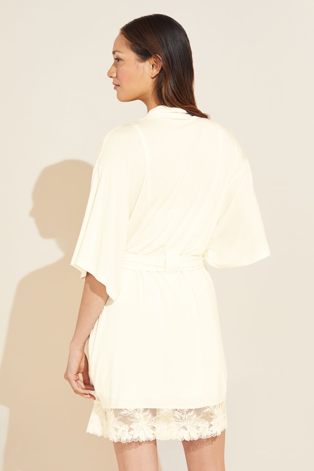 Model wears Rosalia TENCEL™ Modal Robe in Ivory.