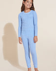 Model wears Kids Printed TENCEL™ Modal Unisex Long PJ Set in Nordic Stripes Vista Blue/Ivory.