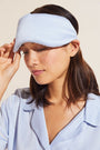 Model wears Inez Washable Silk Eye Mask in Powder Blue.