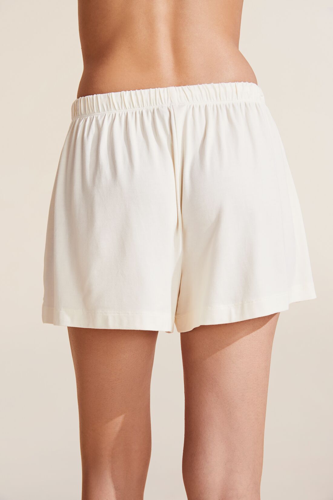 Model wears Gisele TENCEL™ Modal Everyday Relaxed Short in Ivory.