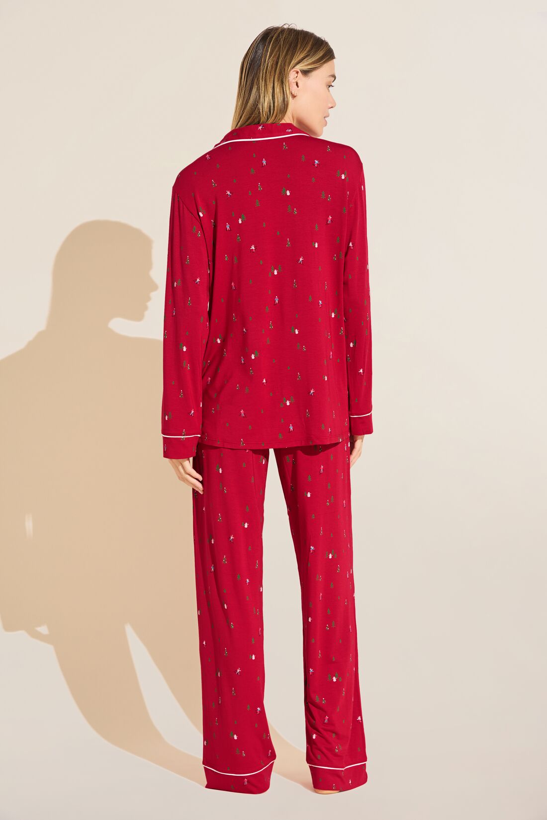 Model wears the Gisele Printed TENCEL™ Modal Long PJ Set in Apres Ski Haute Red/Ivory.