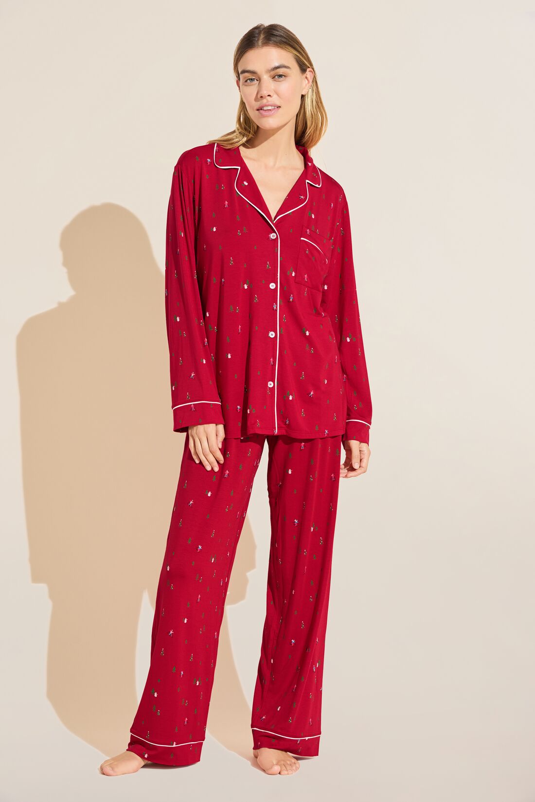 Model wears the Gisele Printed TENCEL™ Modal Long PJ Set in Apres Ski Haute Red/Ivory.