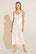 Model wears Inez Washable Silk Slip Dress in Ivory.