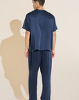 Model wears Charles Washable Silk Short Sleeve & Pant PJ Set in Navy.