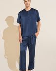 Model wears Charles Washable Silk Short Sleeve & Pant PJ Set in Navy.