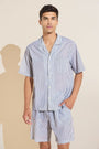 Model wears Men's Organic Sandwashed Cotton Short PJ Set in Nautico Stripe Graphite.