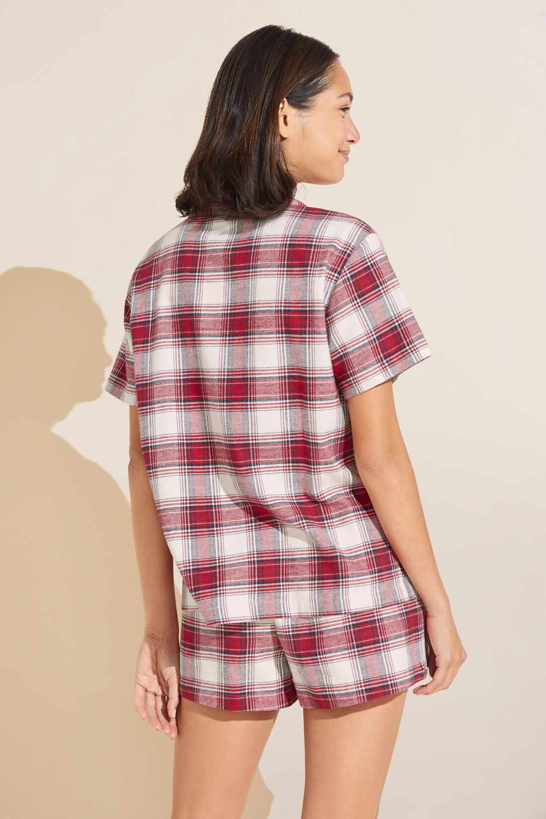 Model wears Flannel Short PJ Set in red and ivory plaid.