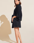 Model wears Naya TENCEL™ Modal Robe in Black.