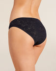 Model wears Soft Stretch Recycled Lace High Leg Brief in Black.